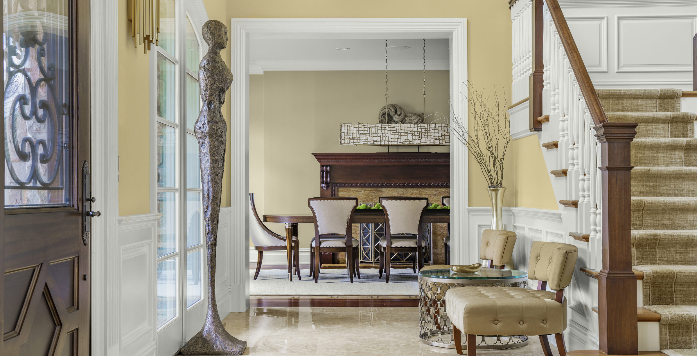 View along the double-height foyer toward the dining room at 1315 Canal Road, Princeton